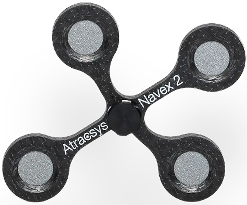 A four-pronged black plastic spinner with gray circular pads at each end; the arms are labeled Atracsys and Navex 2.