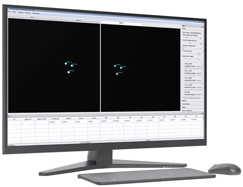 A computer monitor displays scientific software with a black background, showing two panels of molecular or atomic data, numerical tables below, and a mouse and keyboard in front.