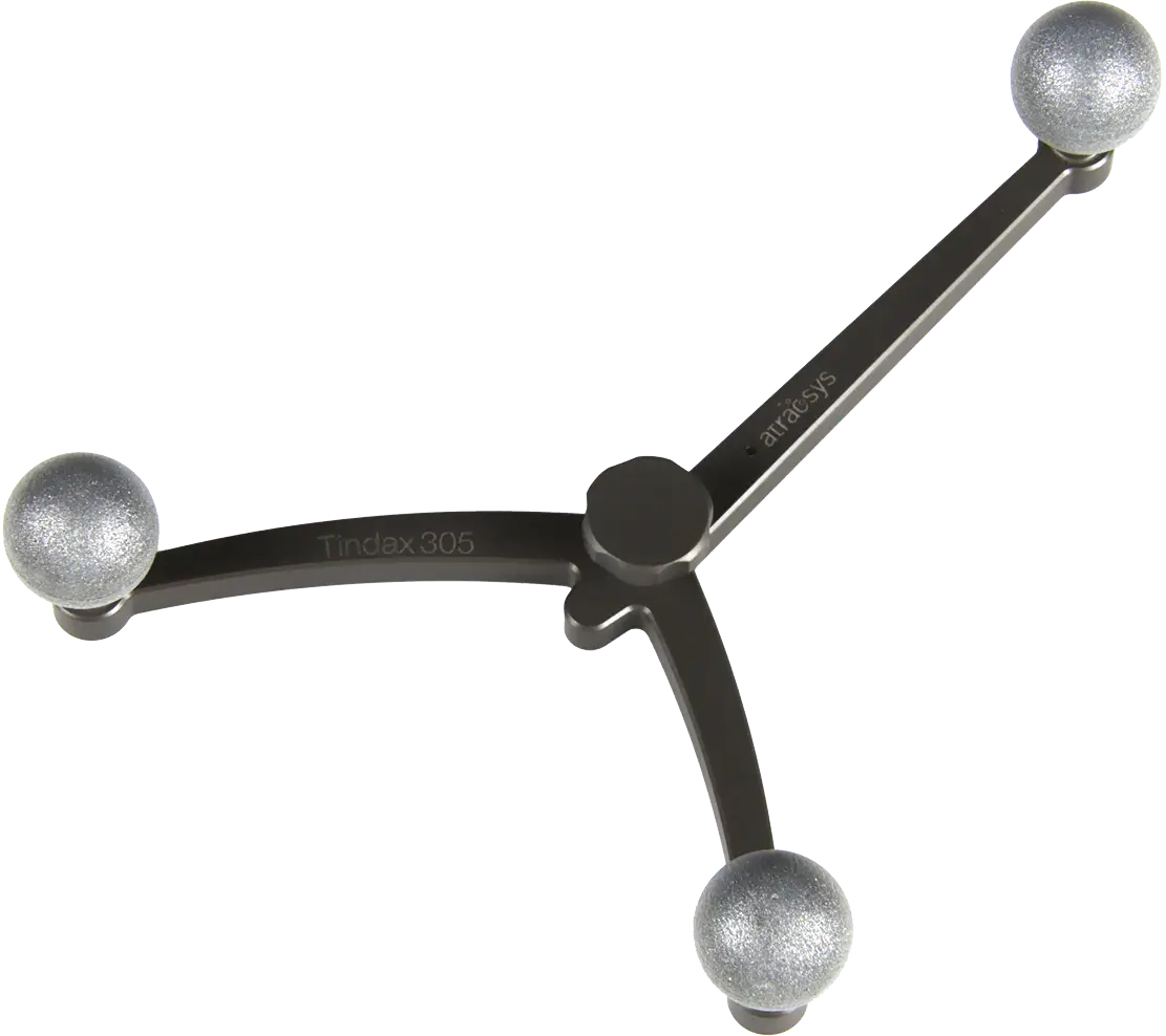 A metallic, three-armed object labeled Tindax 305 with spherical fiducials on each end, resembling a molecular model or a modern decorative piece.