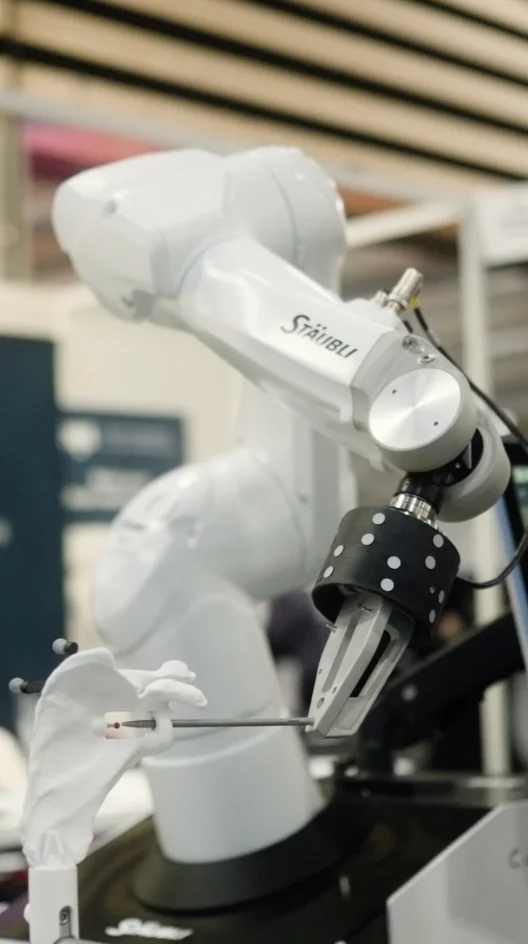 Stäubli robotic arm equipped with an Atracsys omni-directional forpi marker for optical tracking in surgical robotics.